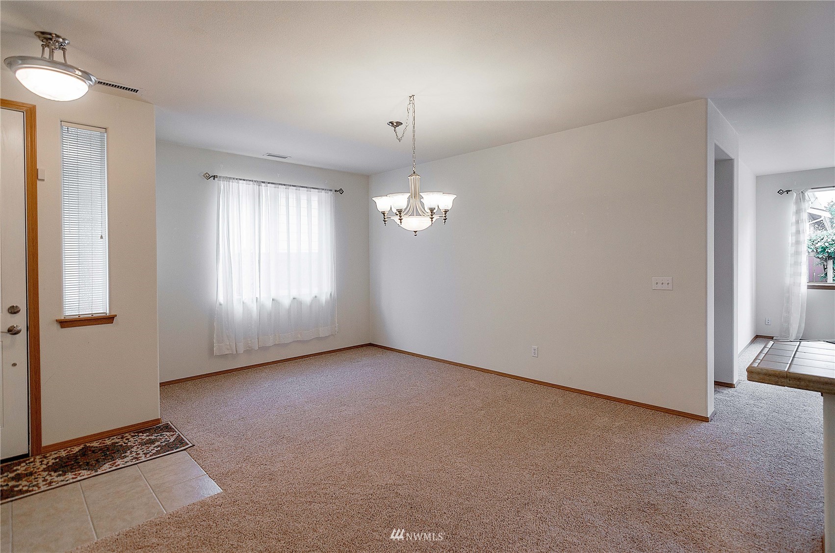 8228 Bainbridge Loop Northeast Lacey, WA 98516 - Photo 10 of 32 an empty room with windows and closet