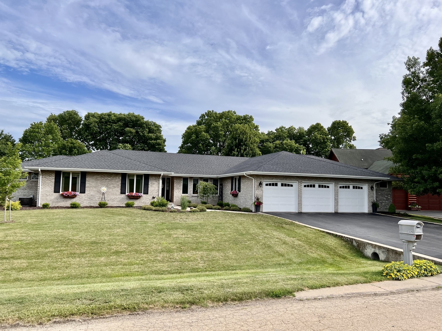329 Rockside Drive Dixon, IL 61021 - Photo 1 of 23 a front view of a house with a garden