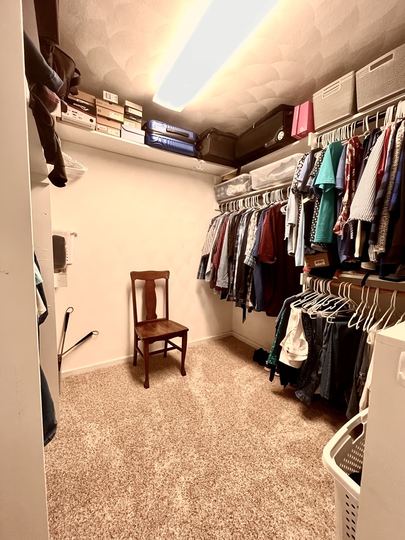 329 Rockside Drive Dixon, IL 61021 - Photo 12 of 23 a view of walk in closet with clothes and shoes