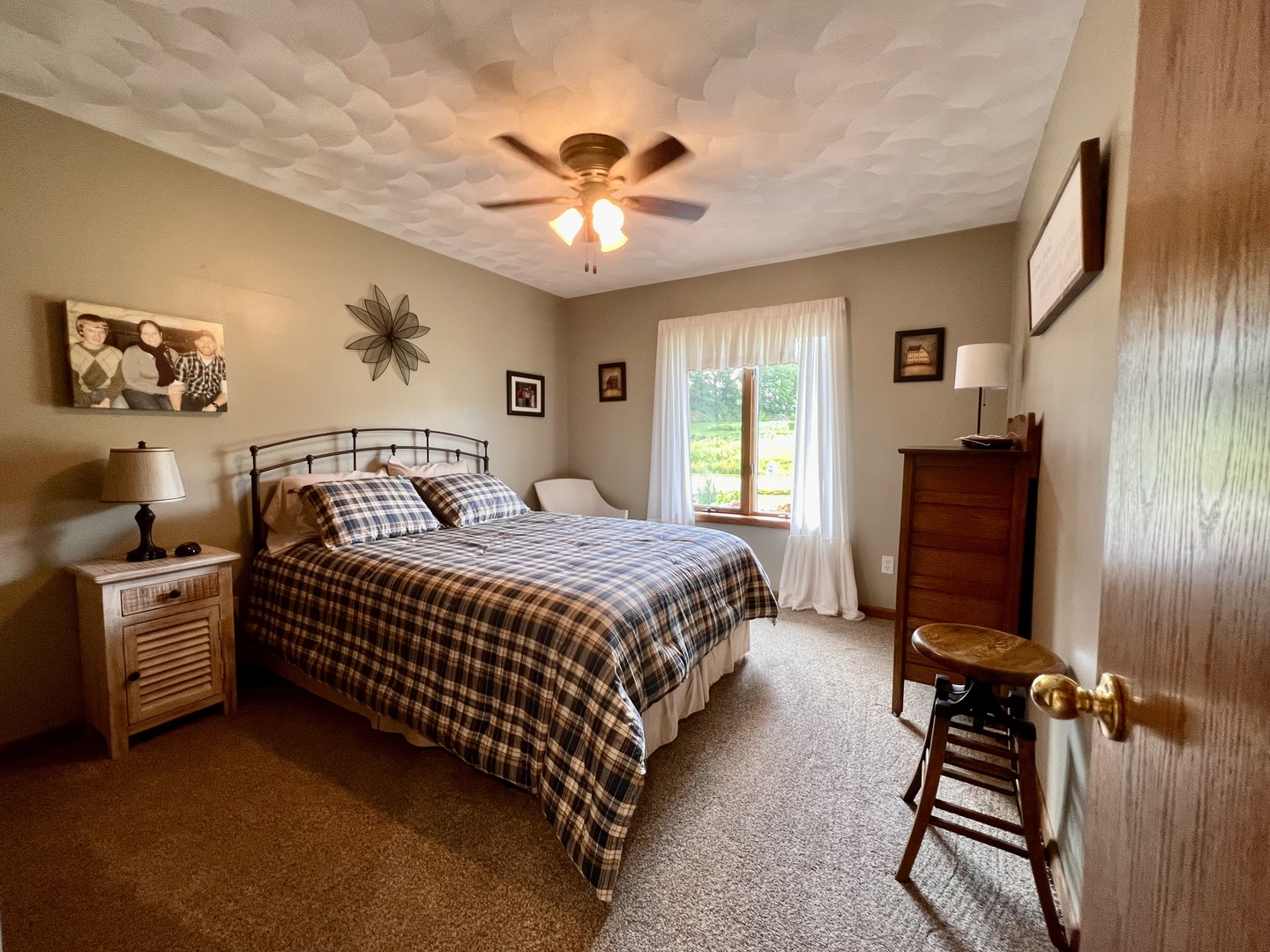 329 Rockside Drive Dixon, IL 61021 - Photo 13 of 23 a bedroom with a bed and a chandelier