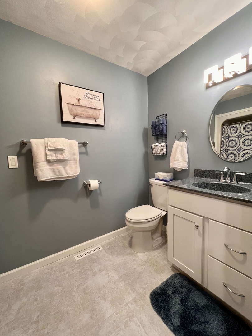 329 Rockside Drive Dixon, IL 61021 - Photo 14 of 23 a bathroom with a toilet a sink and mirror