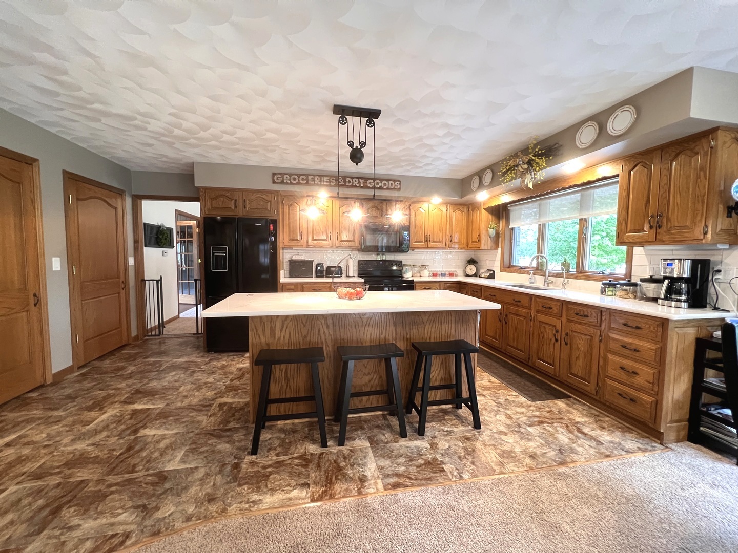329 Rockside Drive Dixon, IL 61021 - Photo 5 of 23 a large kitchen with a table and chairs