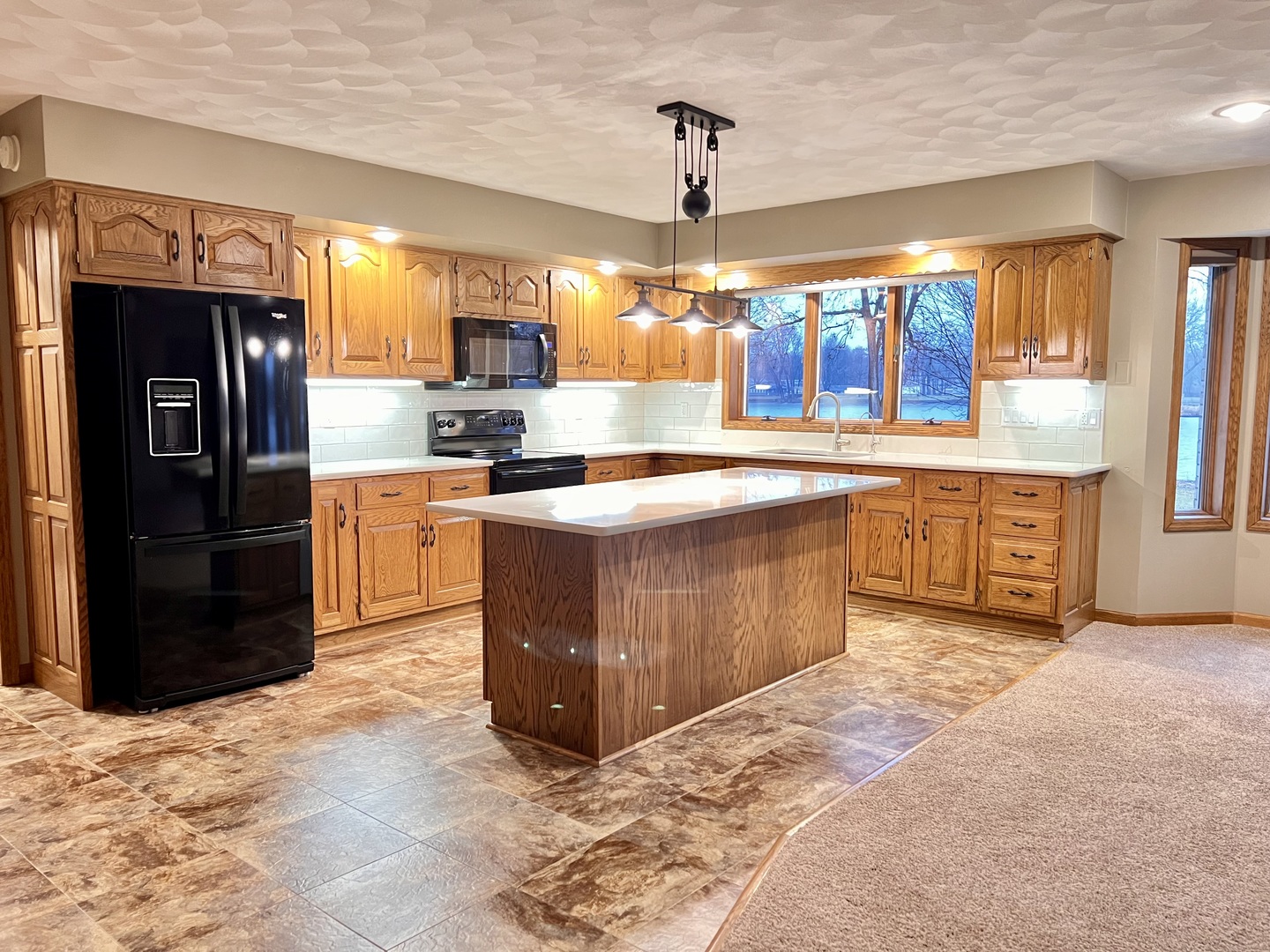 329 Rockside Drive Dixon, IL 61021 - Photo 6 of 23 a kitchen with stainless steel appliances granite countertop a sink counter space cabinets and a counter top space