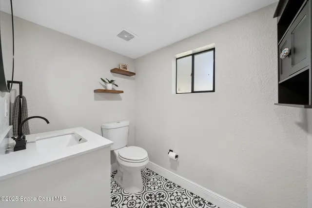 a bathroom with a shower and a toilet