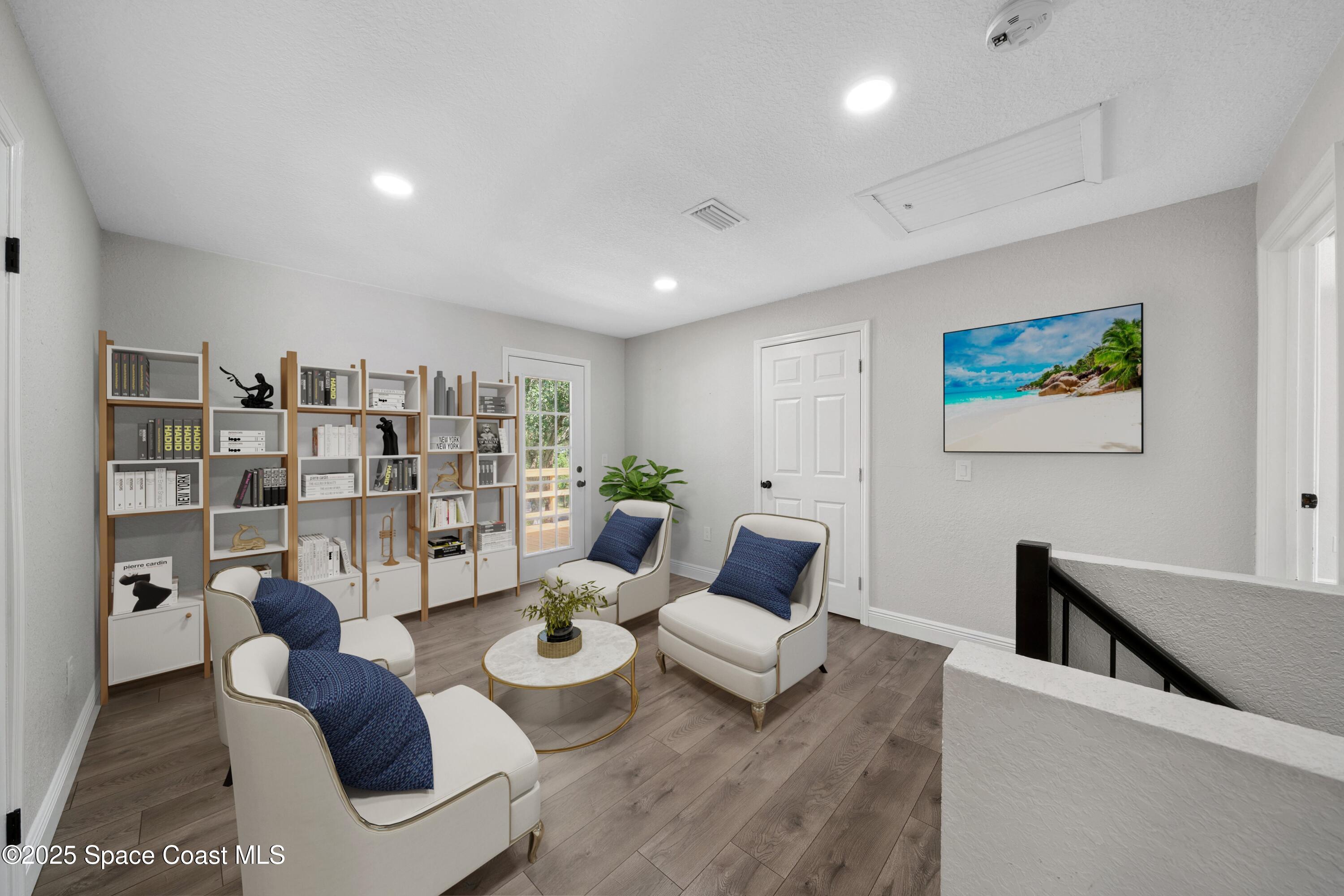 1325 Friday Road Cocoa, FL 32926 - Photo 26 of 59 a living room with furniture and a book shelf