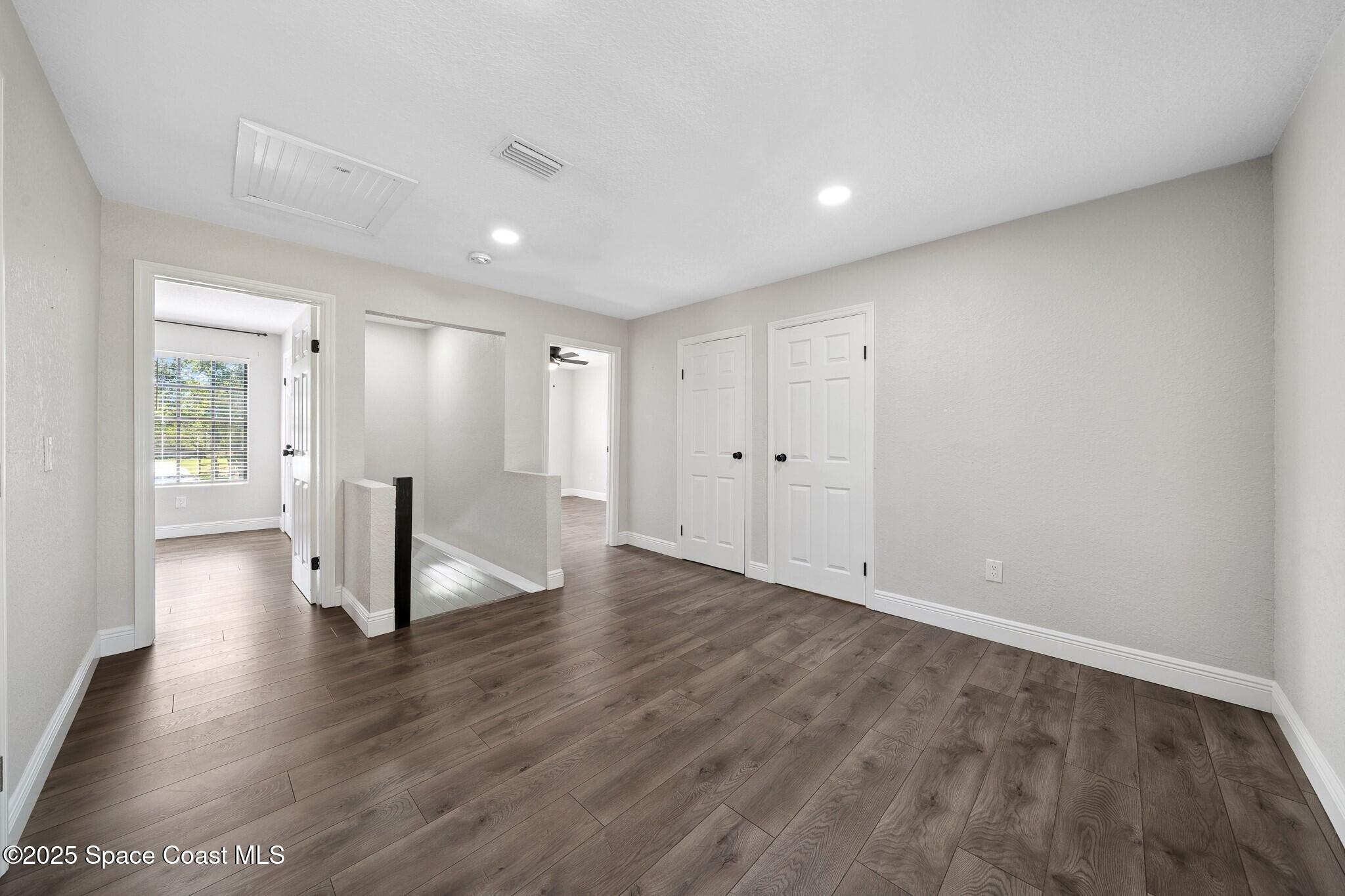 1325 Friday Road Cocoa, FL 32926 - Photo 27 of 59 a view of empty room with wooden floor