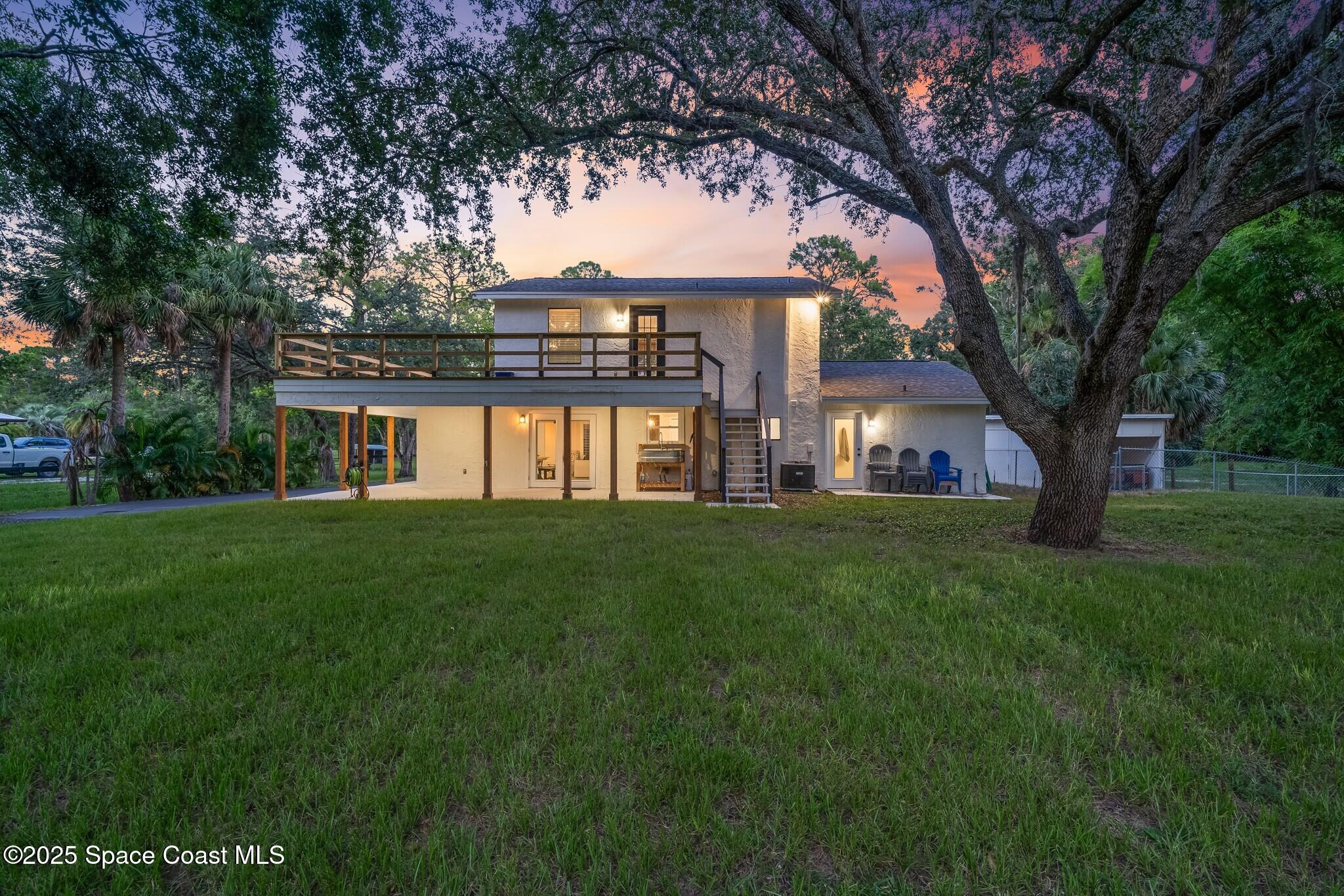 1325 Friday Road Cocoa, FL 32926 - Photo 40 of 59 a front view of a house with a yard