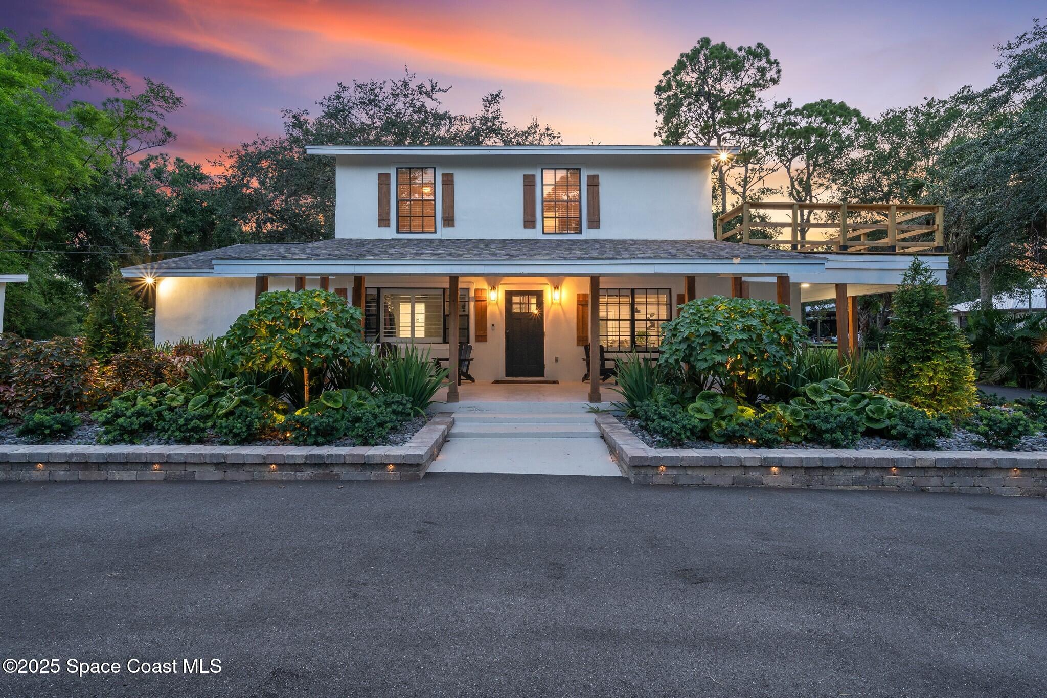 1325 Friday Road Cocoa, FL 32926 - Photo 4 of 59 a front view of a house with yard