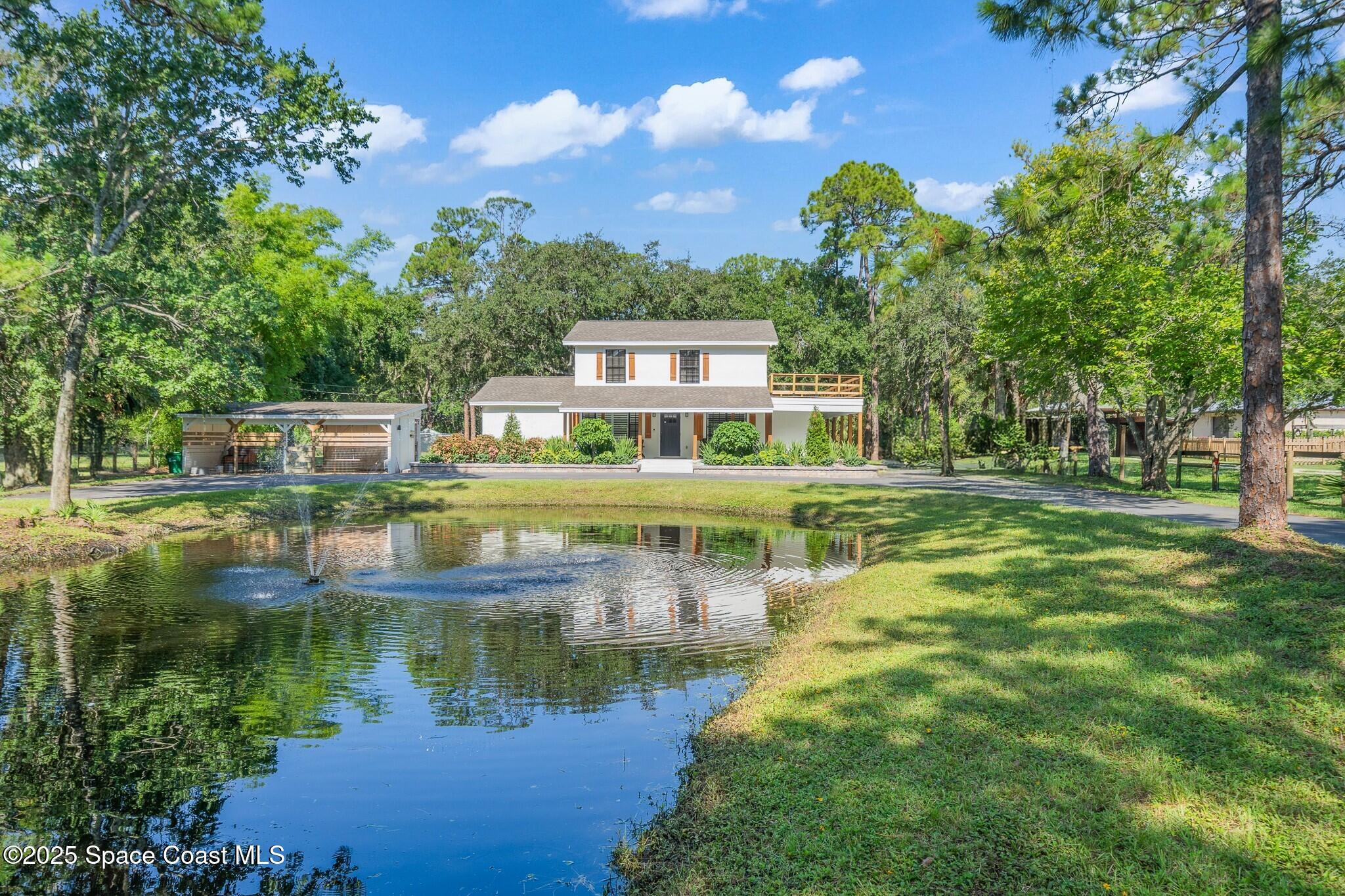1325 Friday Road Cocoa, FL 32926 - Photo 41 of 59 a view of house with swimming pool and a yard