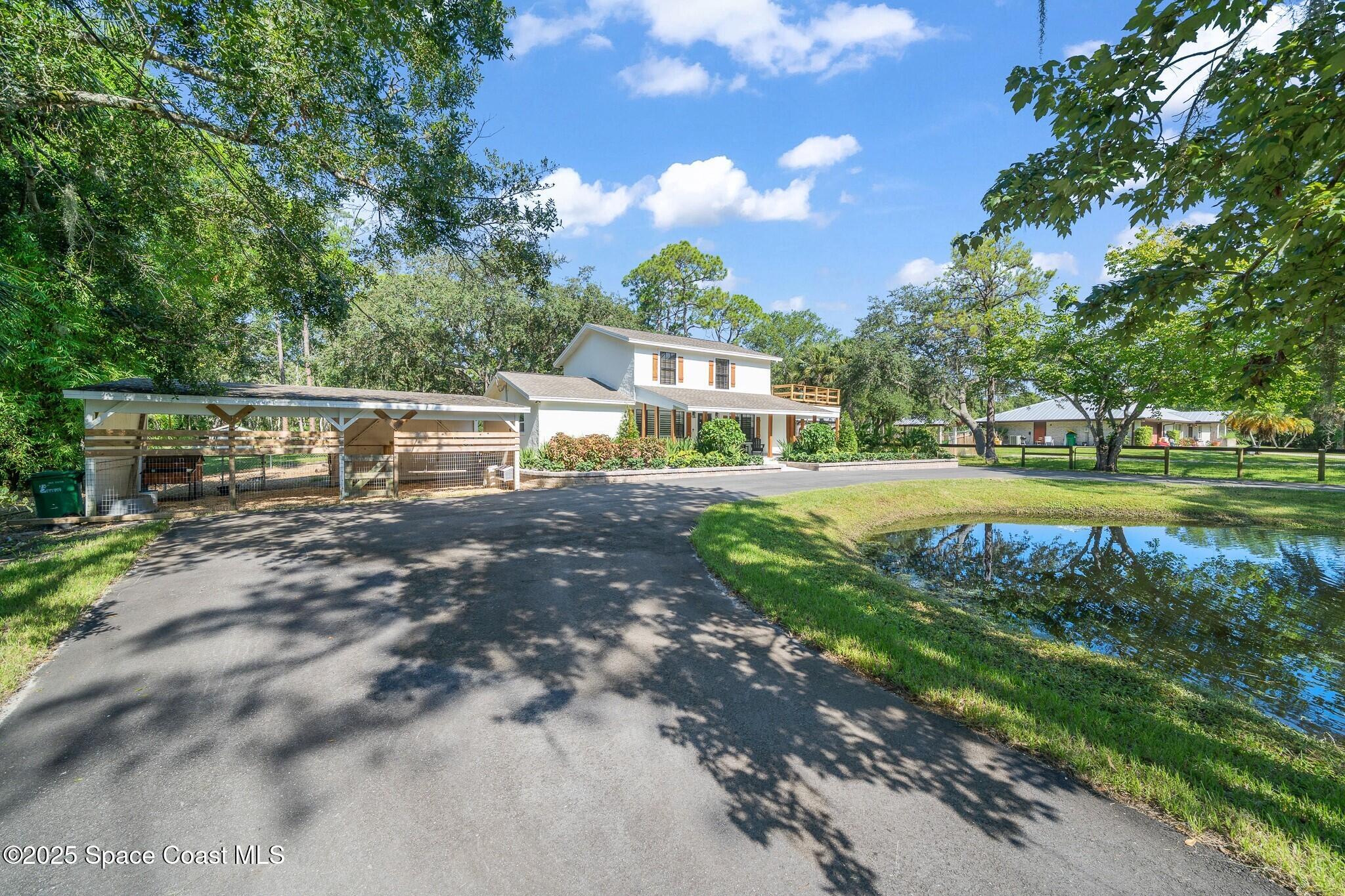 1325 Friday Road Cocoa, FL 32926 - Photo 42 of 59 a view of a house with a yard