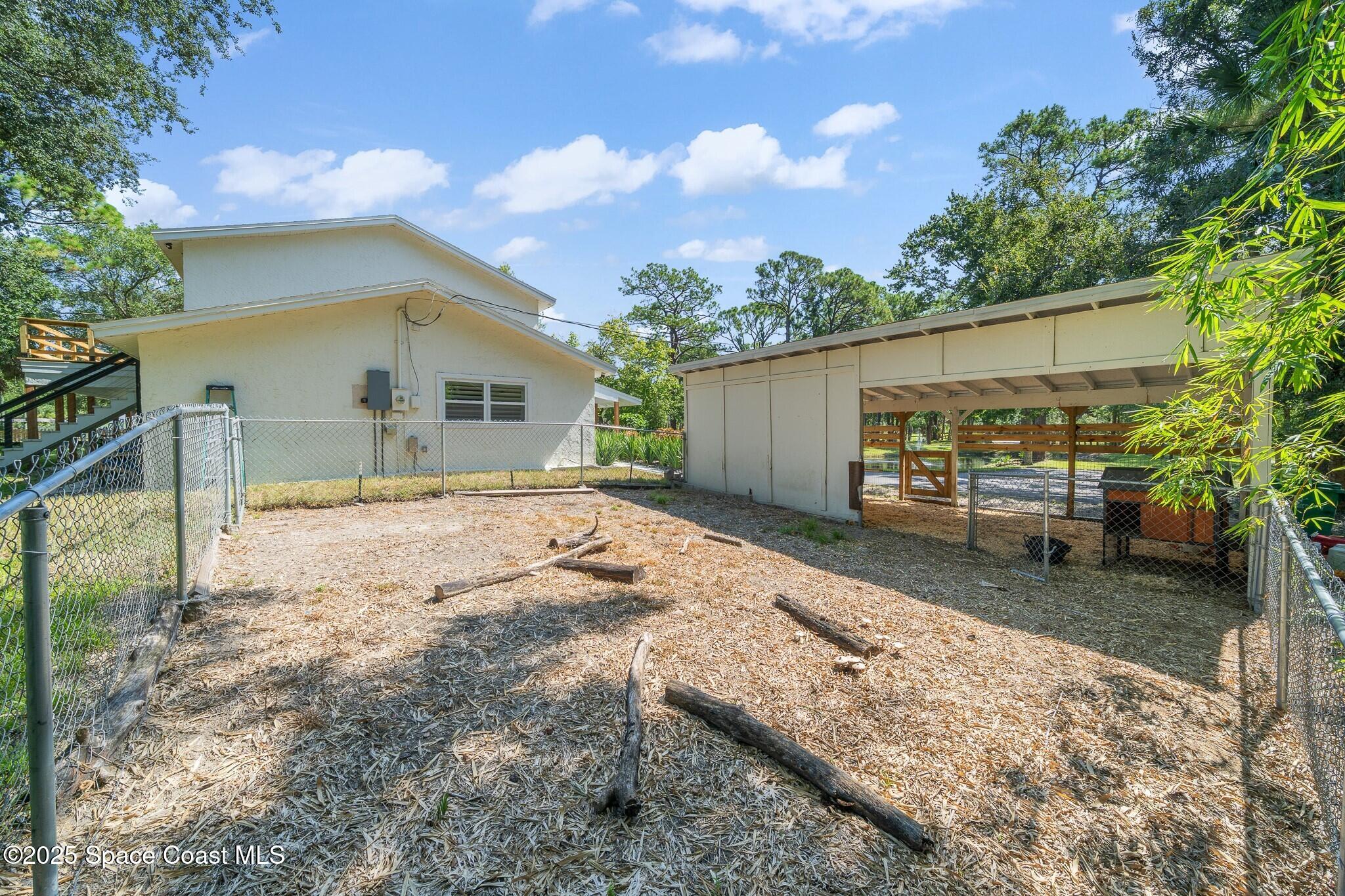 1325 Friday Road Cocoa, FL 32926 - Photo 43 of 59 a view of a house with a yard and large tree