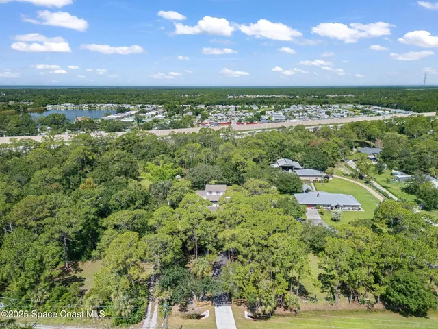 a front view of a house with a yard table and chairs