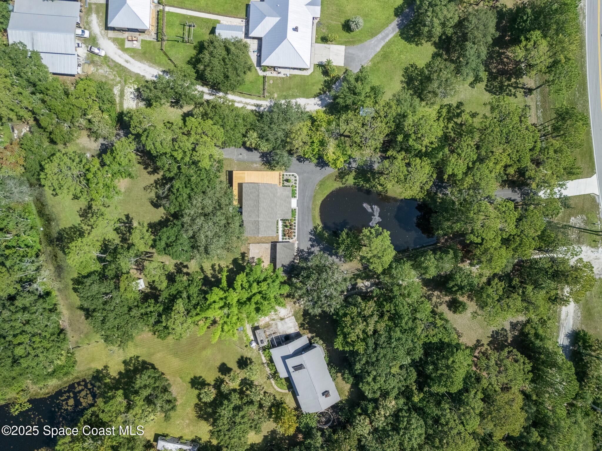 1325 Friday Road Cocoa, FL 32926 - Photo 51 of 59 an aerial view of a house with a yard