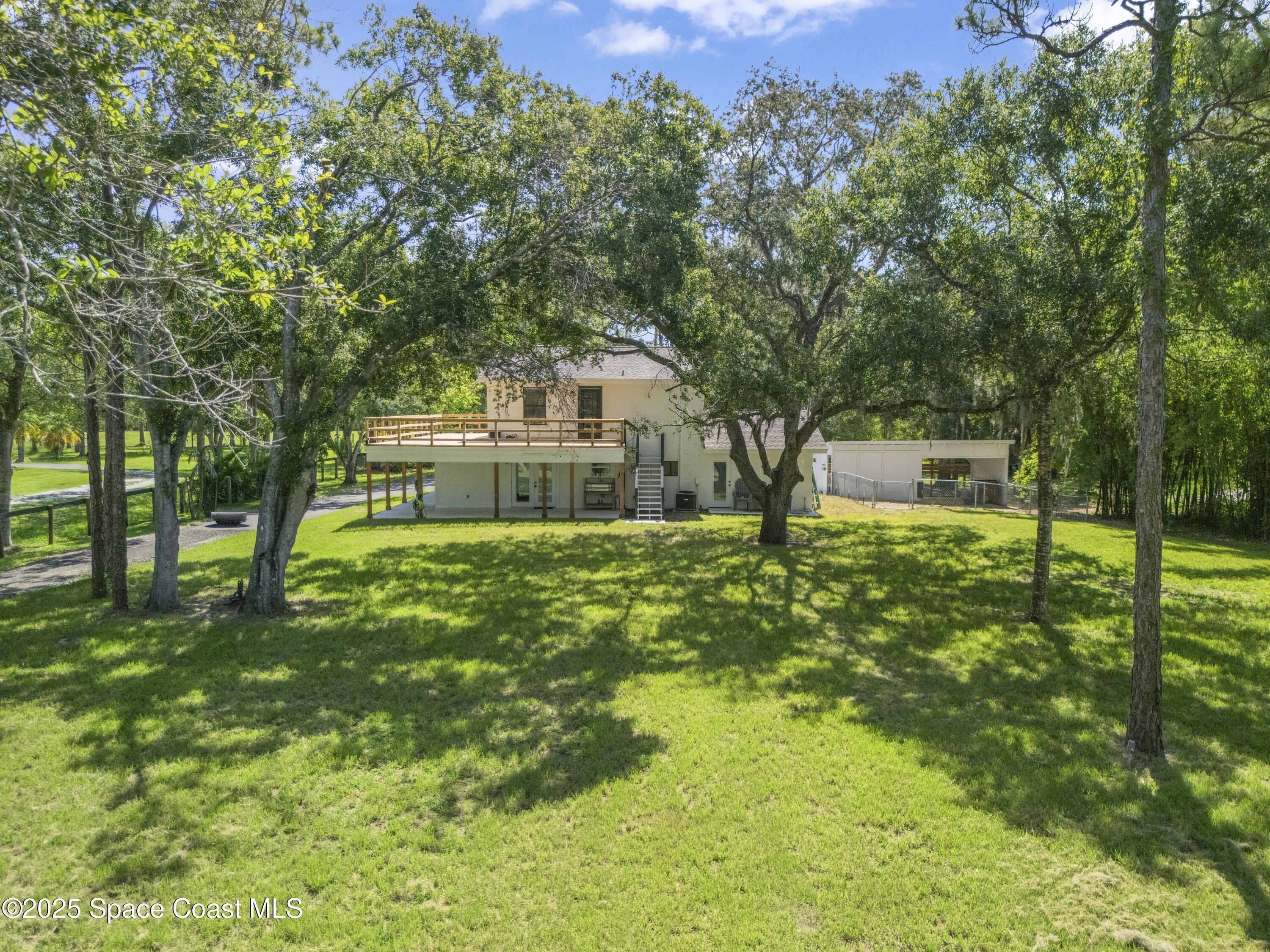 1325 Friday Road Cocoa, FL 32926 - Photo 53 of 59 a front view of a house with garden