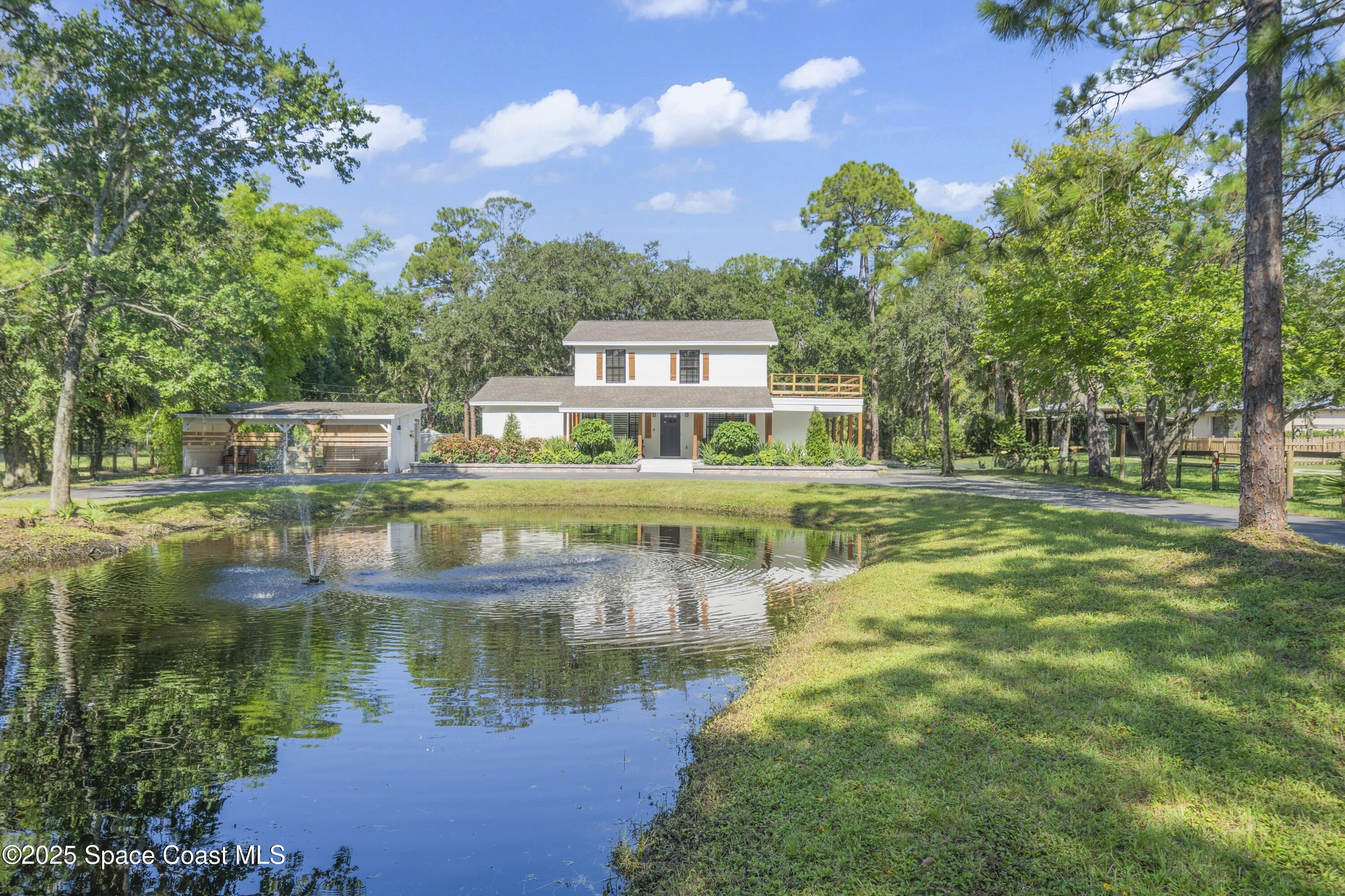 1325 Friday Road Cocoa, FL 32926 - Photo 54 of 59 a view of residential houses with yard and lake view
