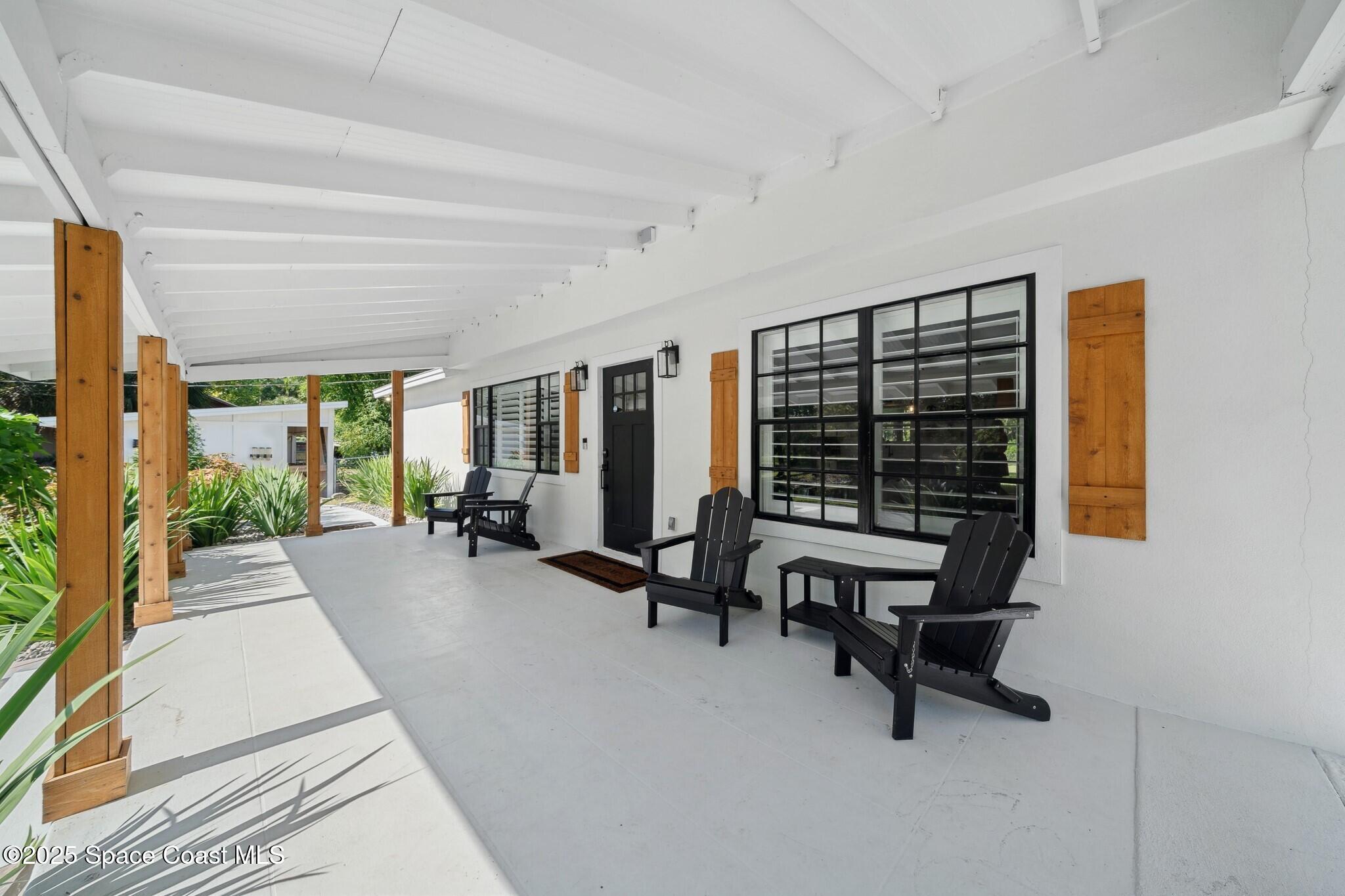 1325 Friday Road Cocoa, FL 32926 - Photo 8 of 59 a view of a livingroom with furniture and floor to ceiling window