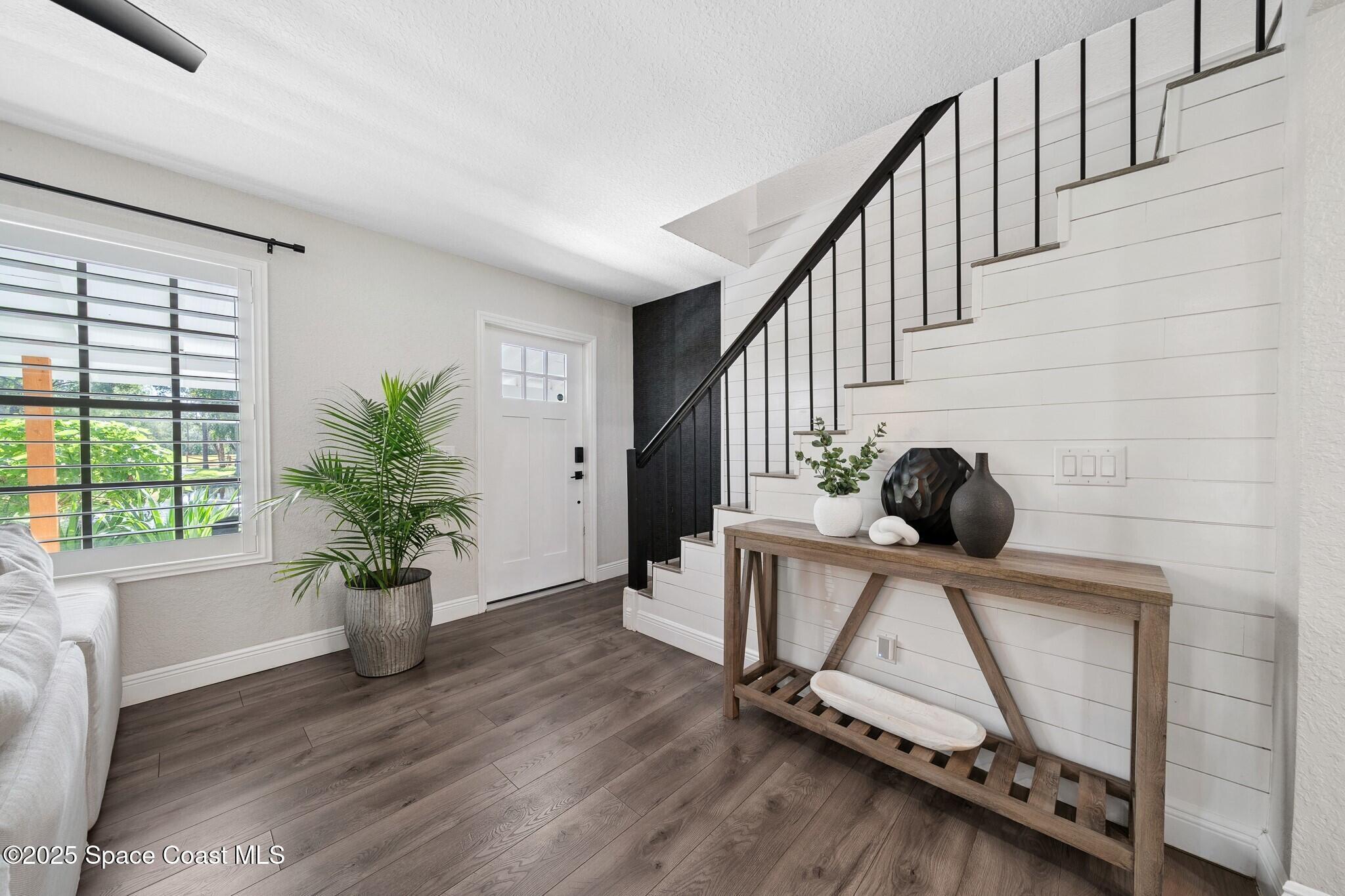 1325 Friday Road Cocoa, FL 32926 - Photo 9 of 59 a view of entryway with wooden floor and window
