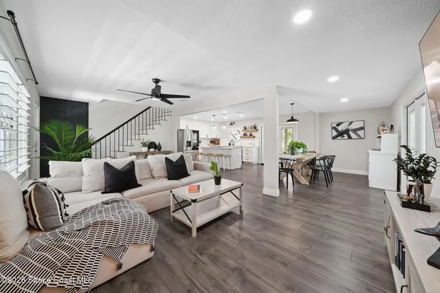 a kitchen that has a lot of counter space and wooden floor