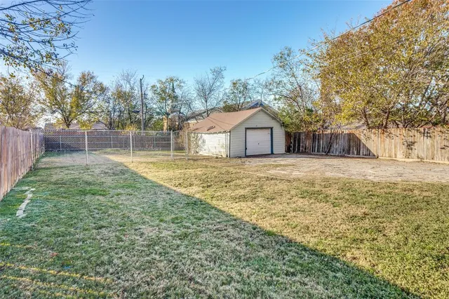a house with trees in the background