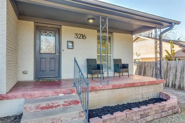 a dining table with chairs and window