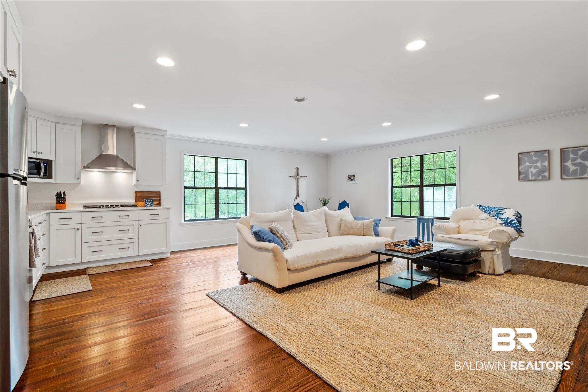 2228 Riverside Drive Mobile, AL 36605 - Photo 37 of 51 Living room featuring a healthy amount of sunlight, ornamental molding, and hardwood / wood-style floors