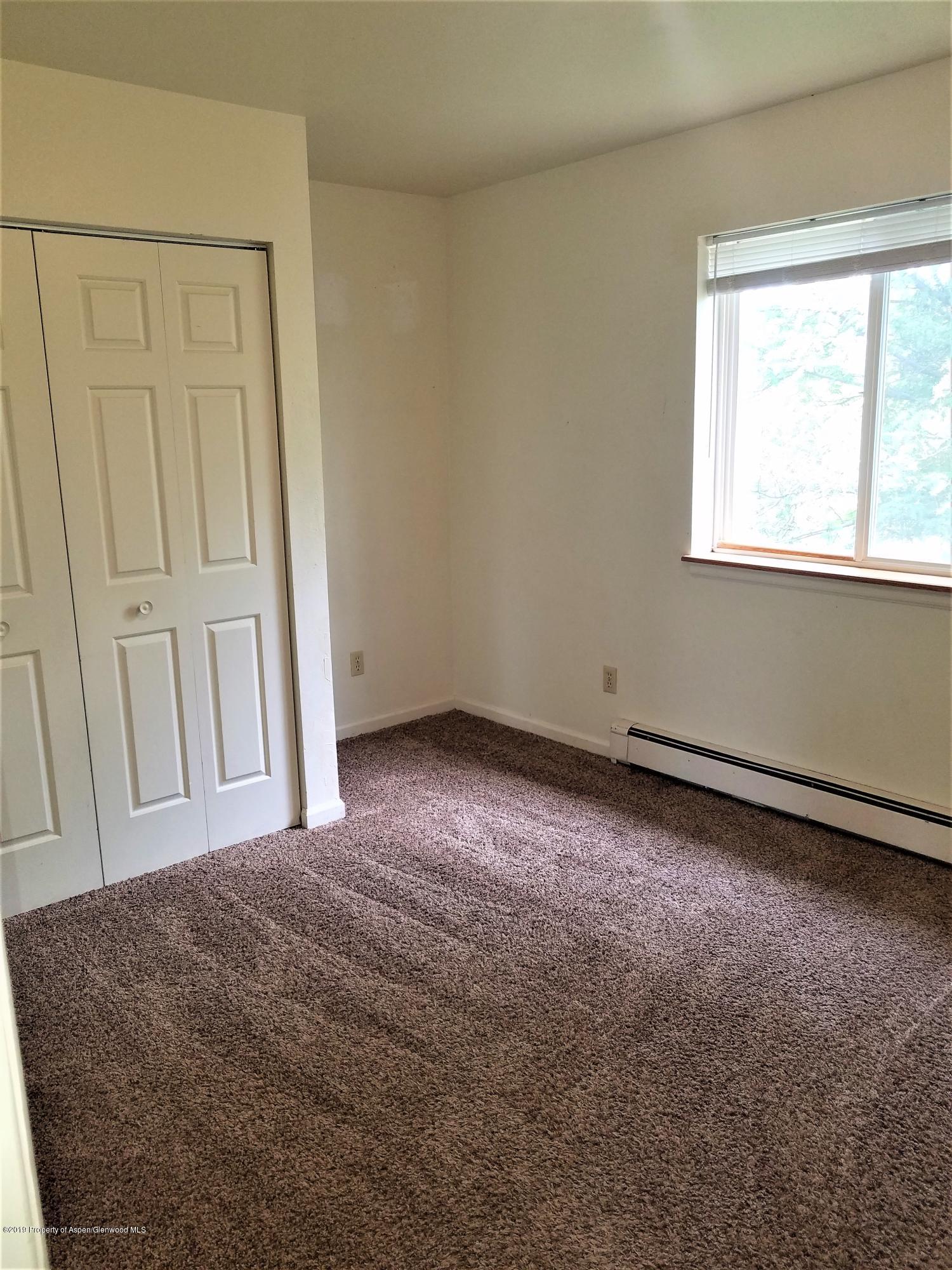 1526 Arabian Avenue Rifle, CO 81650 - Photo 11 of 20 a view of empty room with window