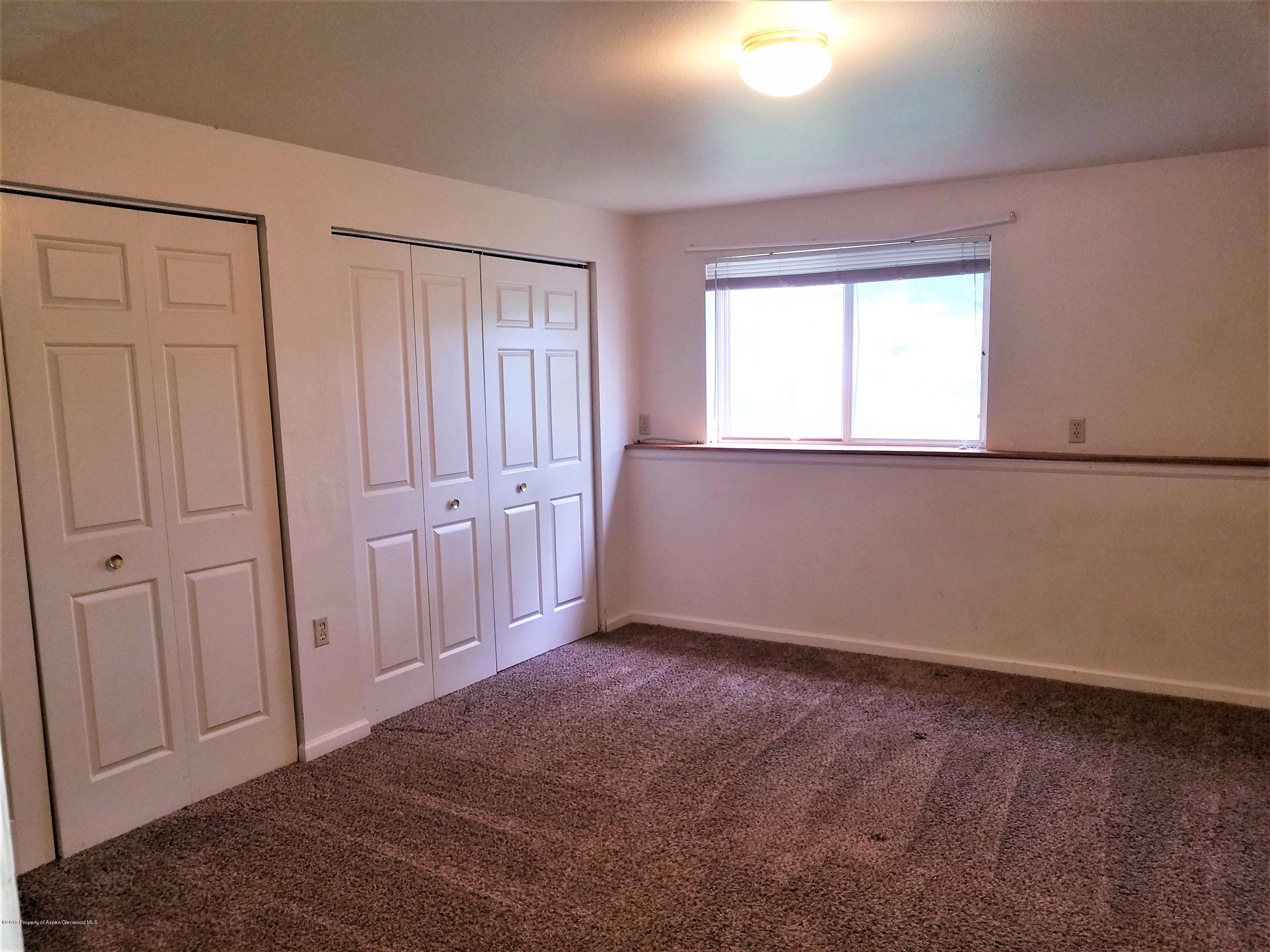 1526 Arabian Avenue Rifle, CO 81650 - Photo 12 of 20 an empty room with a window