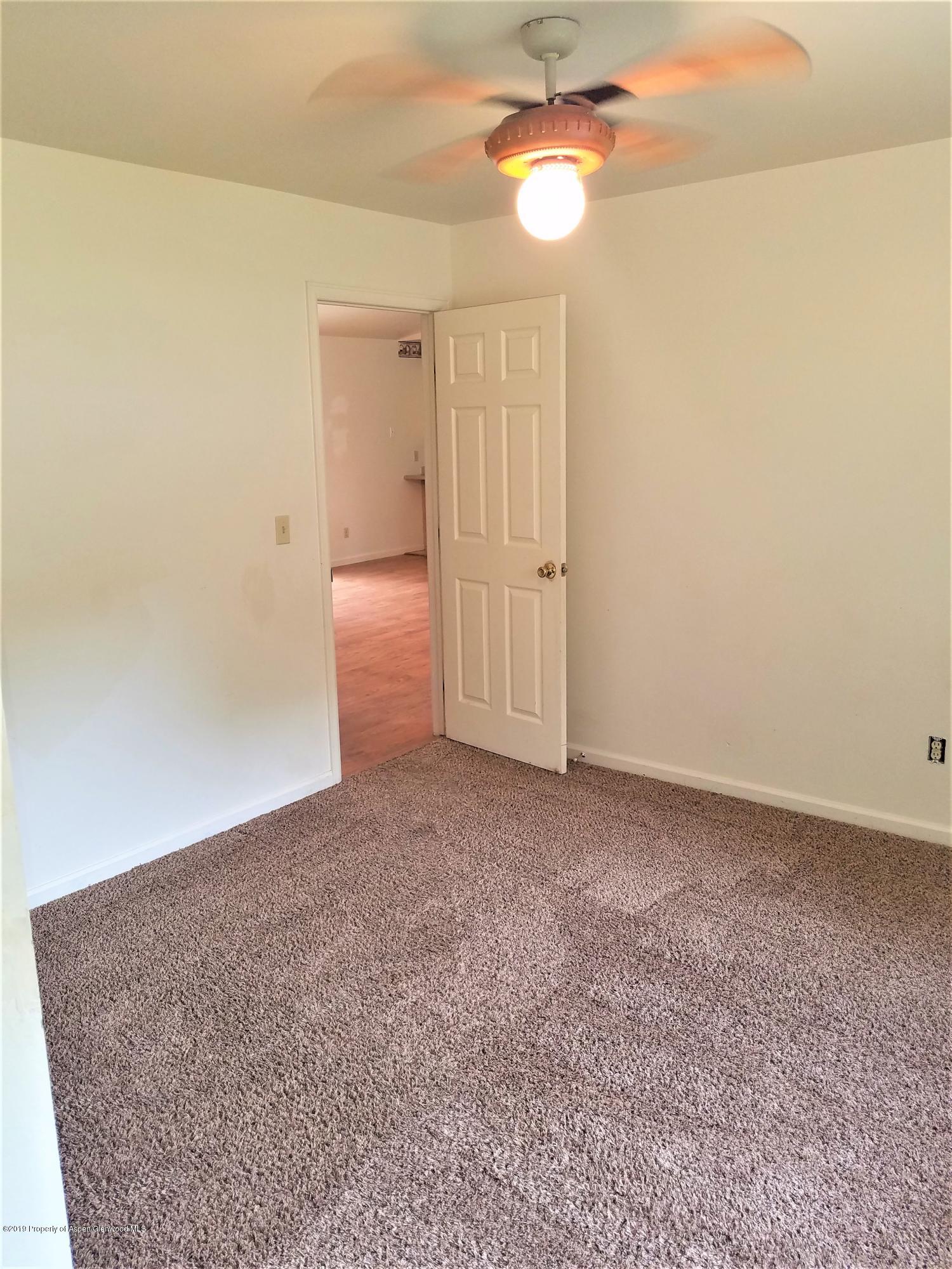 1526 Arabian Avenue Rifle, CO 81650 - Photo 10 of 20 a view of empty room with a ceiling fan