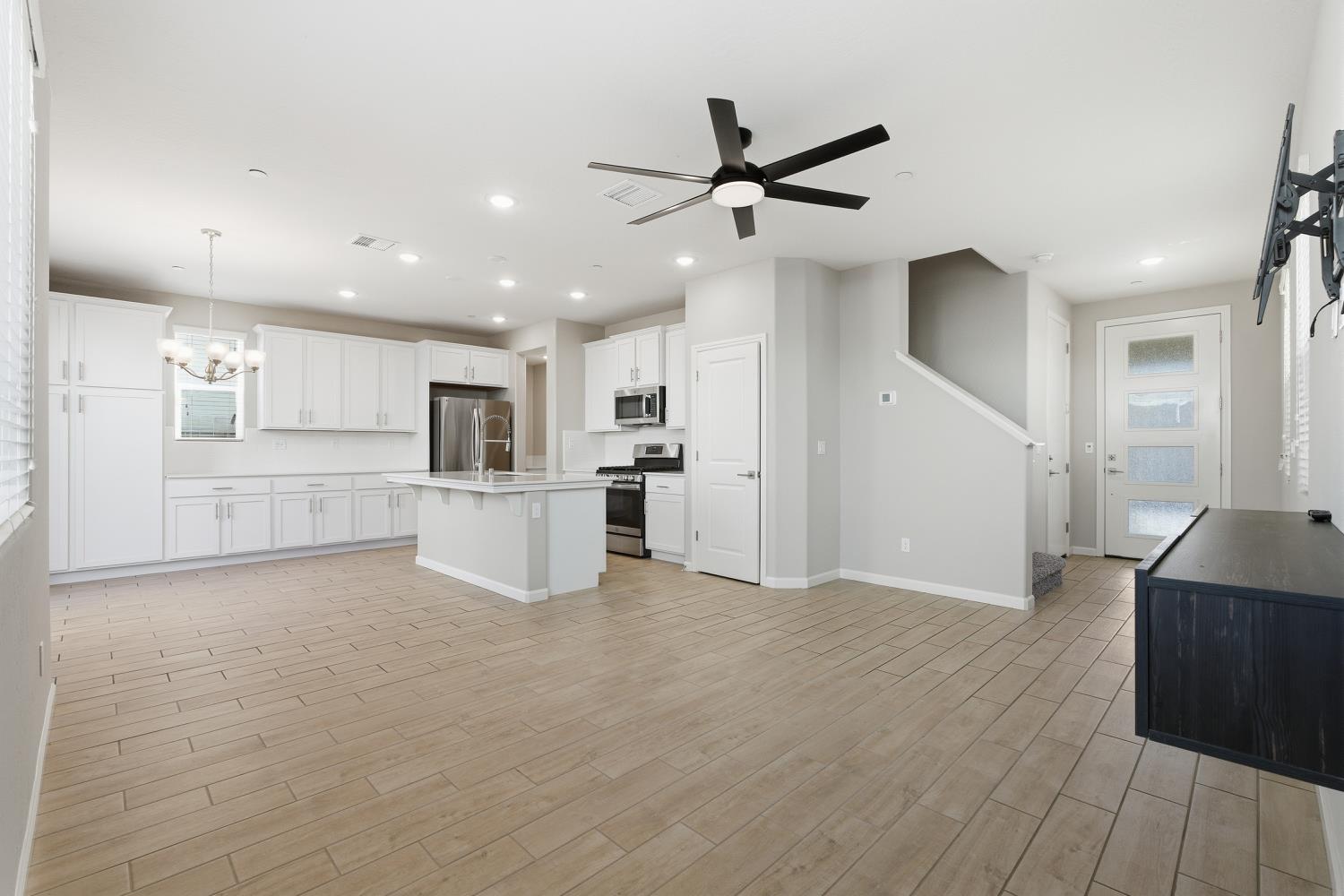 1107 Significant Way West Madera, CA 93636 - Photo 11 of 42 a view of a kitchen with a sink and a refrigerator