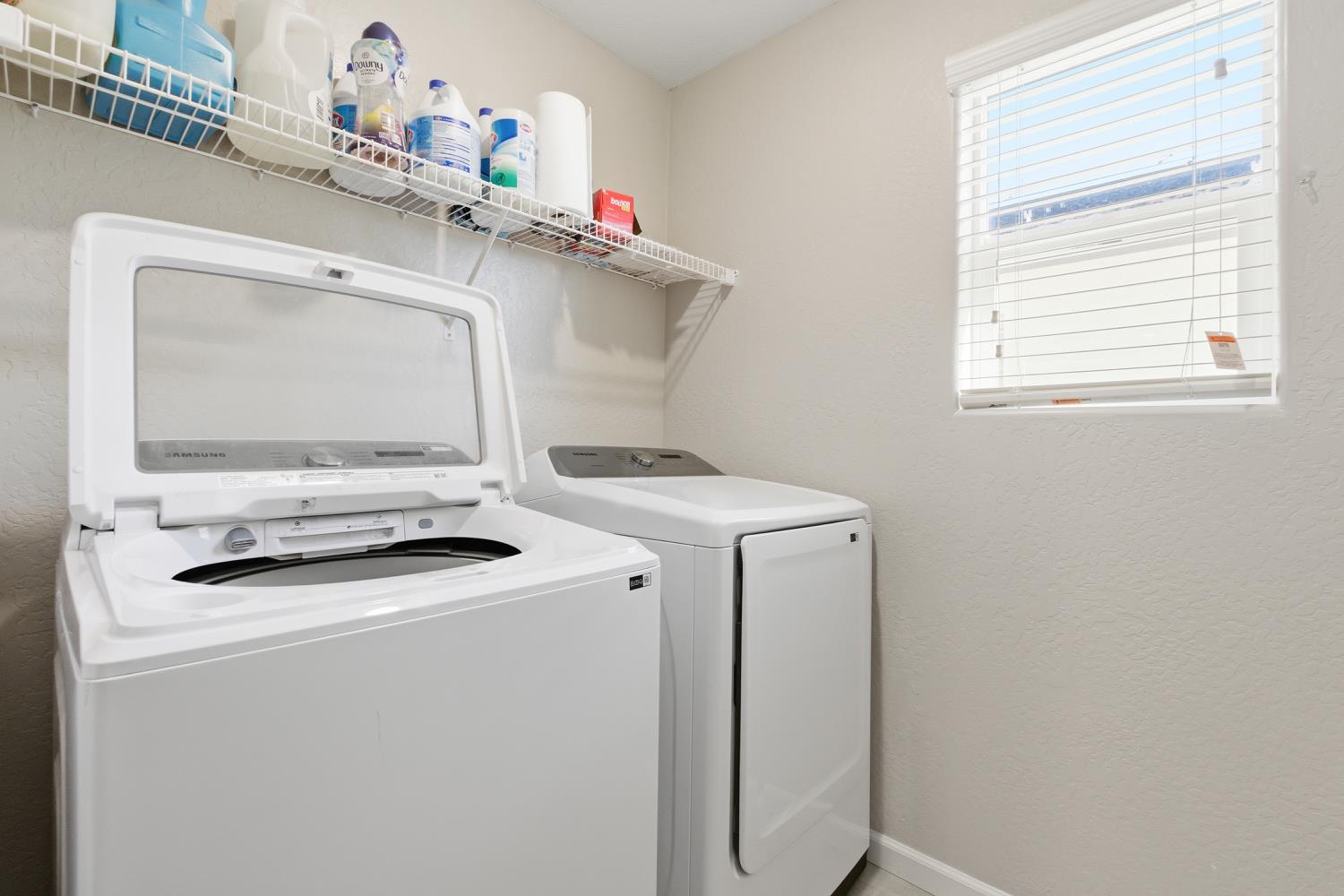 1107 Significant Way West Madera, CA 93636 - Photo 22 of 42 a utility room with dryer and washer