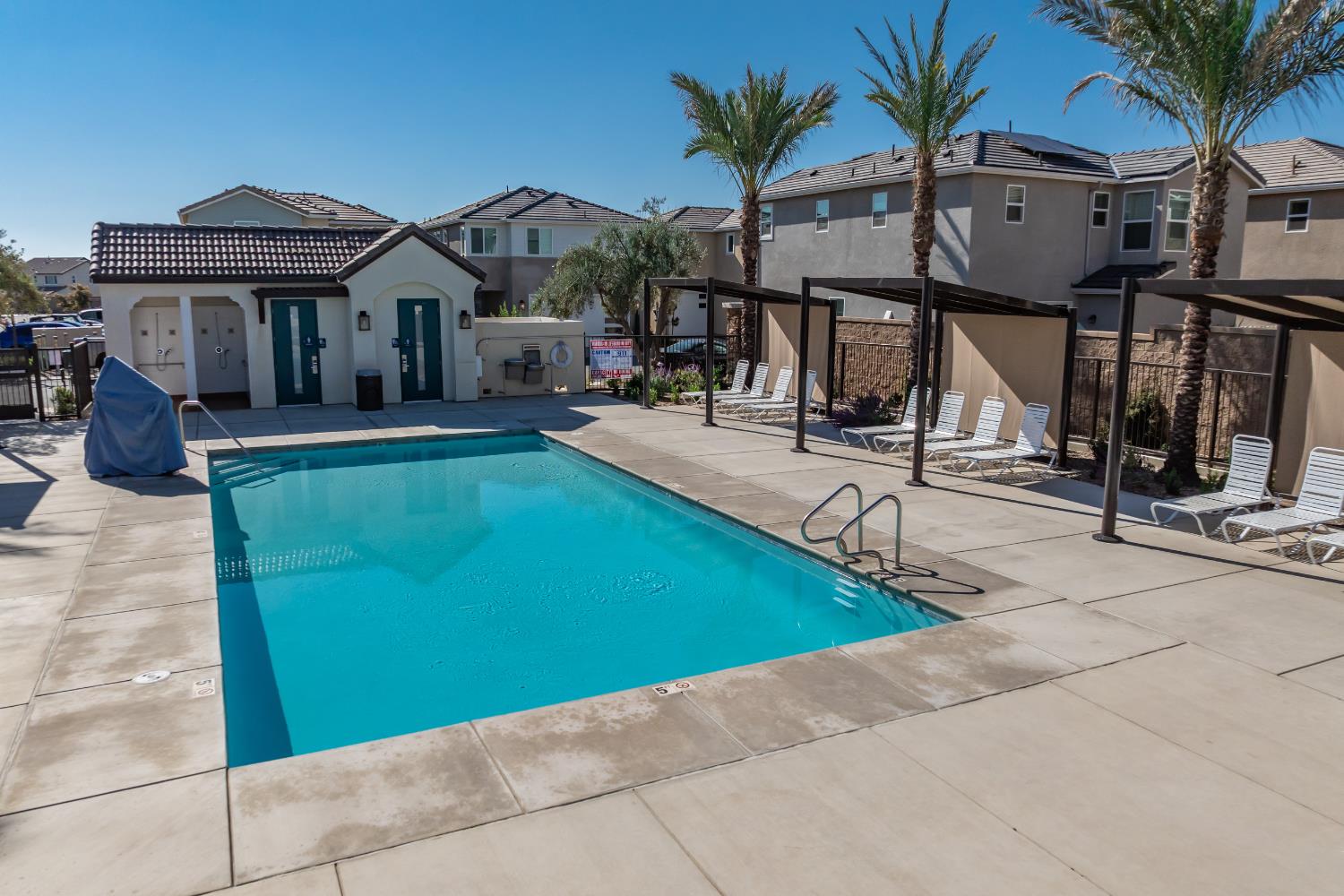1107 Significant Way West Madera, CA 93636 - Photo 42 of 42 a view of house with outdoor space and swimming pool