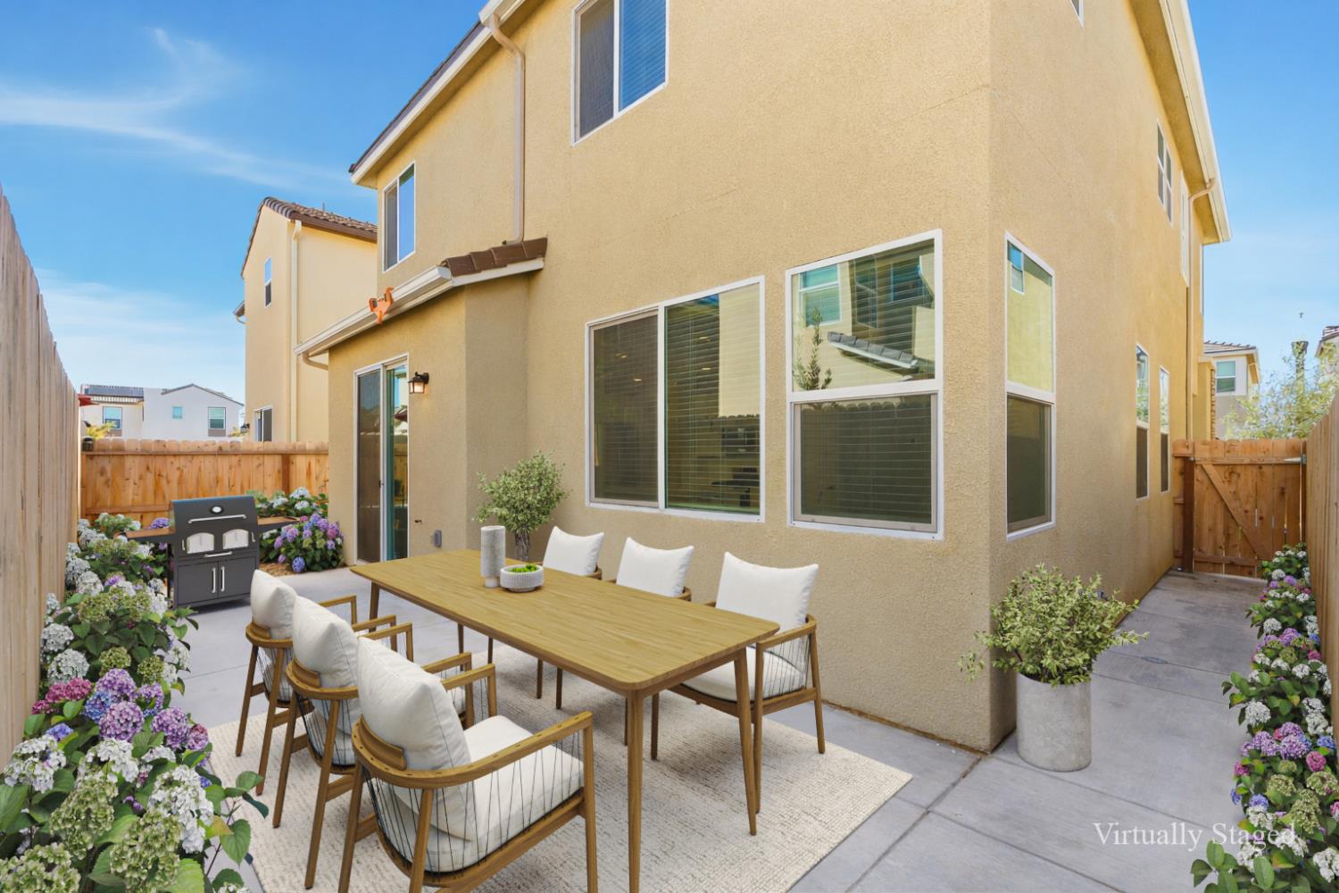 1107 Significant Way West Madera, CA 93636 - Photo 6 of 42 a view of a patio with couches table and chairs and potted plants