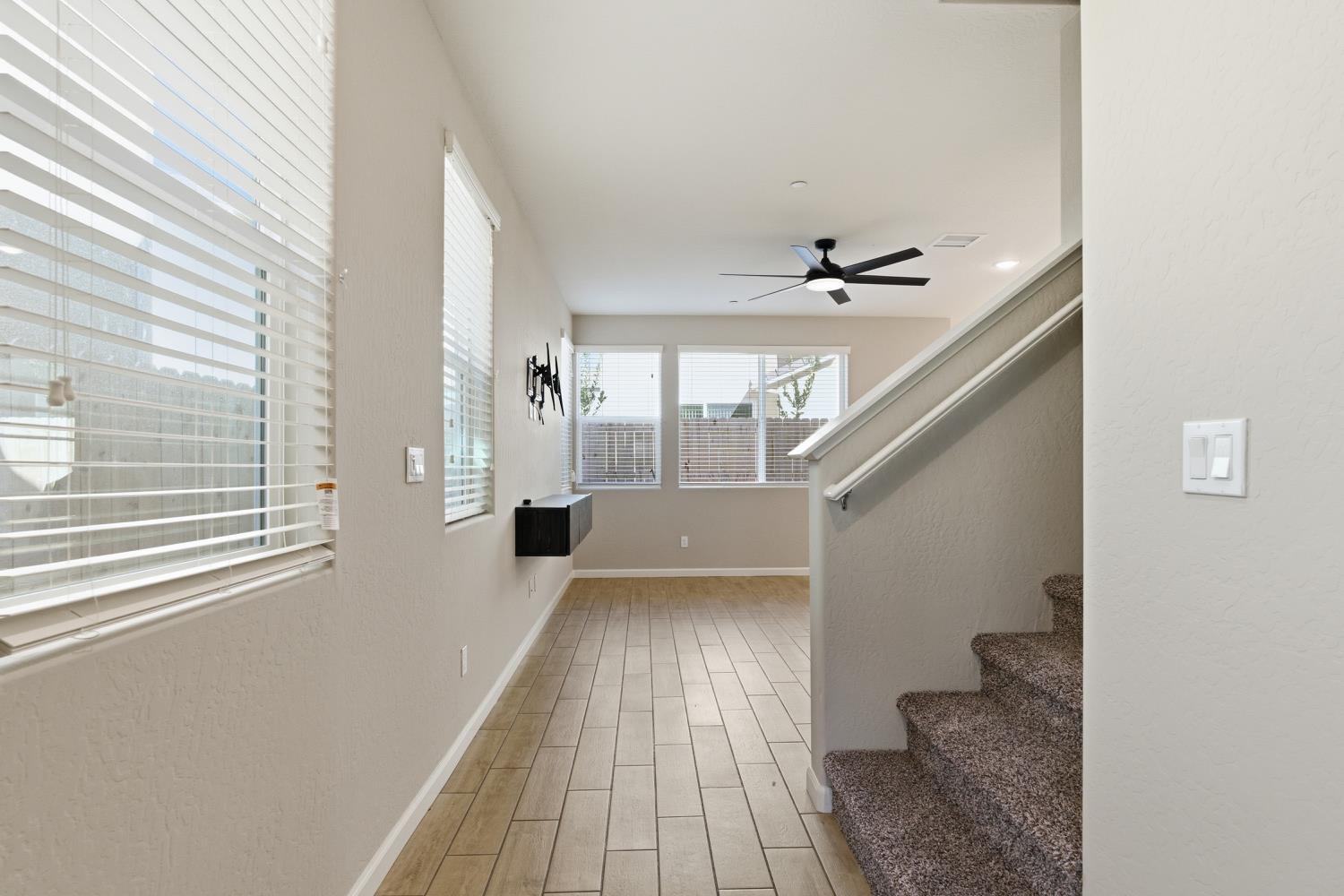 1107 Significant Way West Madera, CA 93636 - Photo 8 of 42 a view of entryway and hall with wooden floor
