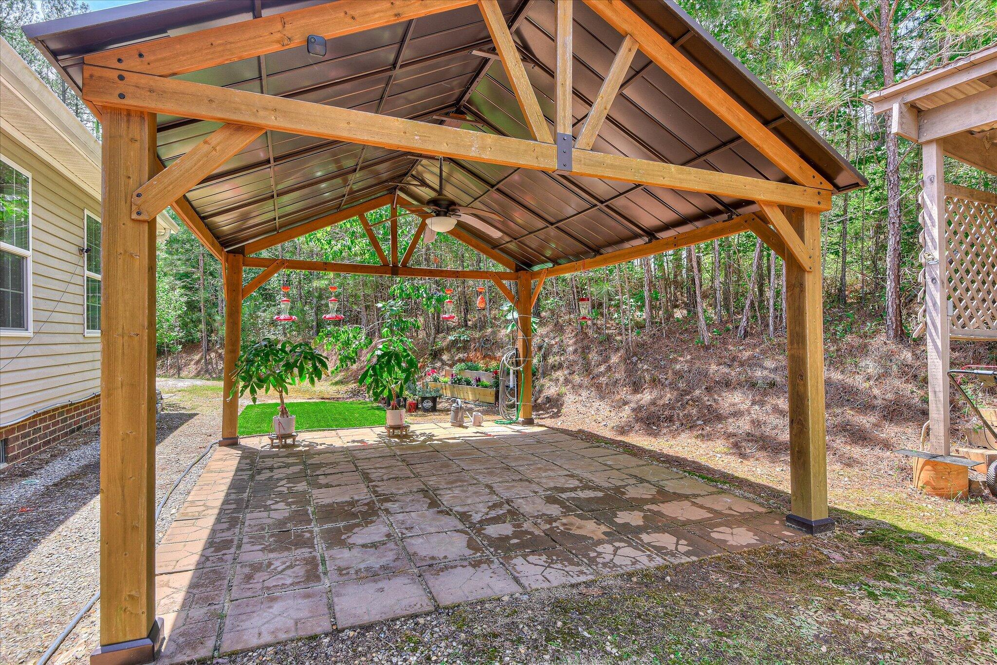 1405 Garrett Road Clarks Hill, SC 29821 - Photo 41 of 51 a view of a backyard with a small cabin