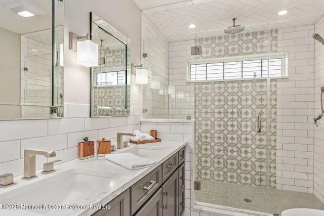 a bathroom with a sink double vanity and shower