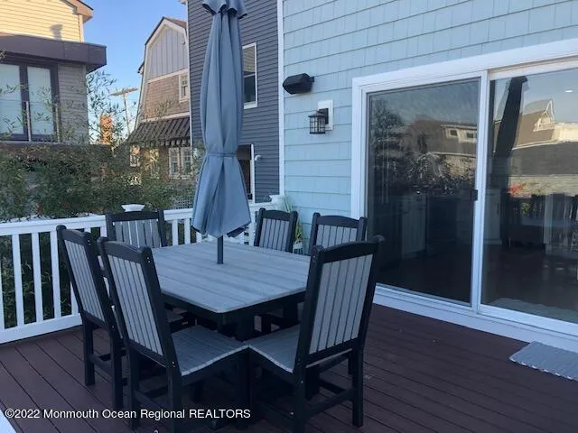 a view of a patio with table and chairs