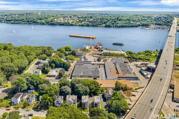 an aerial view of a house with a lake view