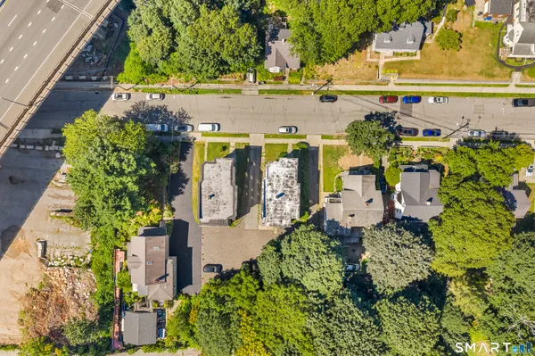 an aerial view of a house with a yard and plants