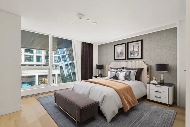 a bathroom with a double vanity sink mirror and shower