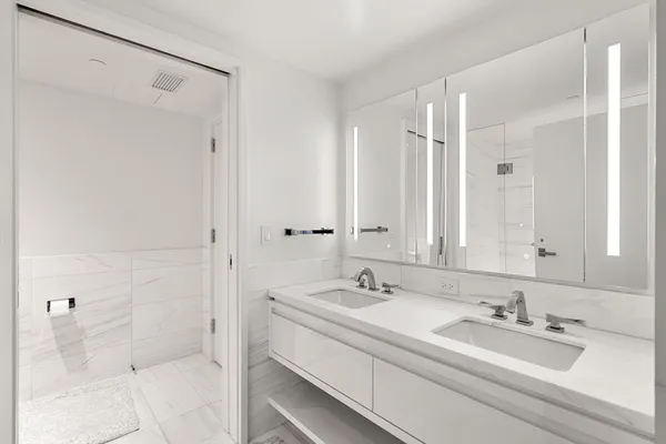 a bathroom with a shower and a sink