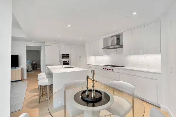 a kitchen with a sink and a refrigerator