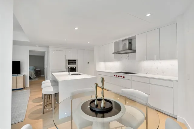 a kitchen with a sink and a refrigerator