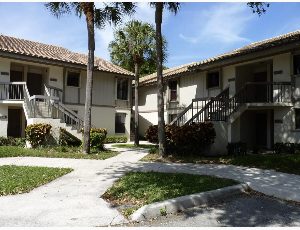 3130 Millwood Terrace, Unit 2120 Boca Raton, FL 33431 - Photo 2 of 15 a view of a house with a yard