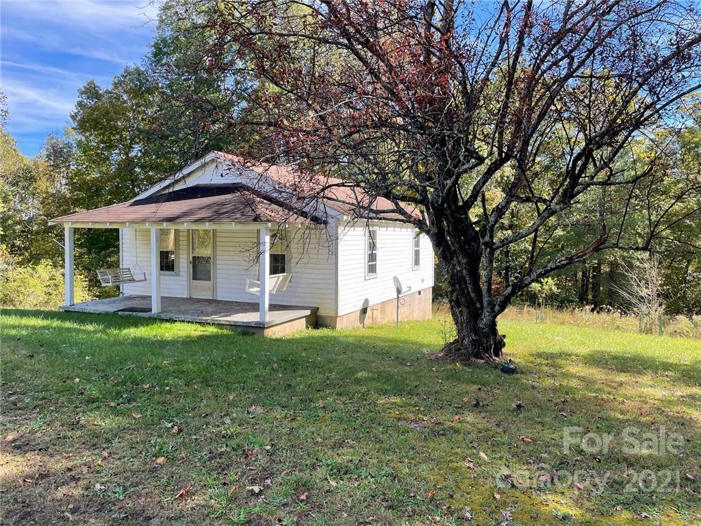 603 Freeman Town Road Rutherfordton, NC 28139 - Photo 1 of 1 a backyard of a house with yard table and chairs