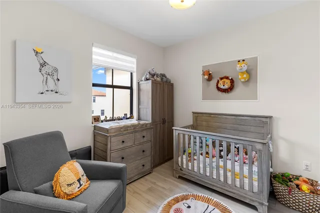 a bedroom with furniture and a window