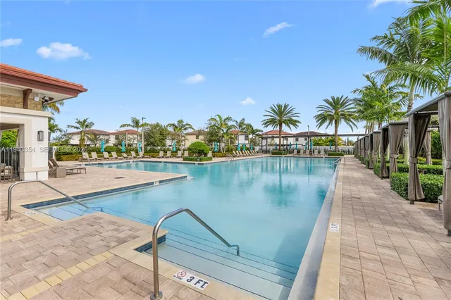 a view of a swimming pool with a patio