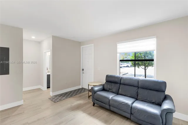 a living room with furniture and a window