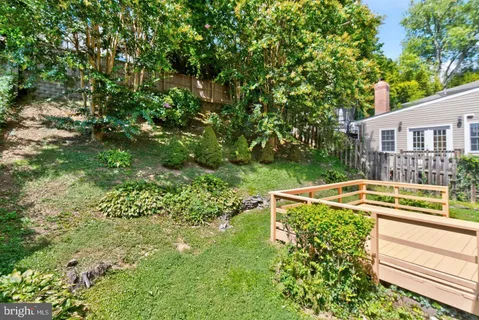a view of a house with pool and sitting area