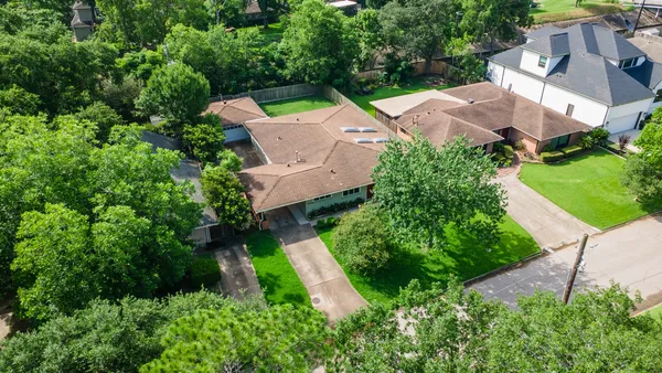 an aerial view of house with yard