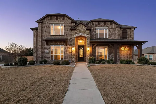 an aerial view of residential houses with city view